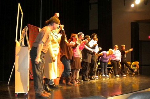 The cast of a play taking a bow